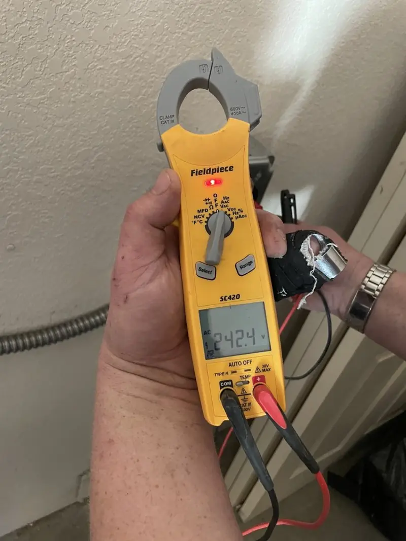 Voltage testing with clamp meter during Recessed Lighting Installation in Shelton